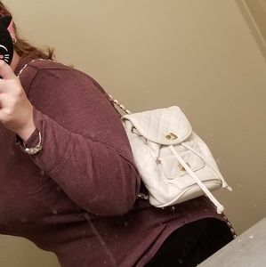 White mini backpack with gold hardware
